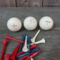 3 balles et tee de golf